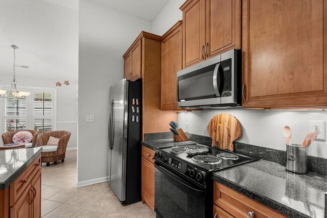 Building Photo - Live the Coastal Lifestyle in This Cypress Keys Beauty!