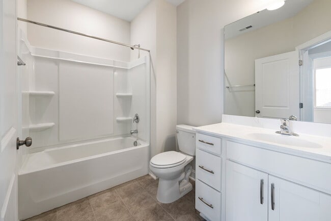 Building Photo - Available 08/15! Spacious Townhome in Prime Andrew Chapel Community