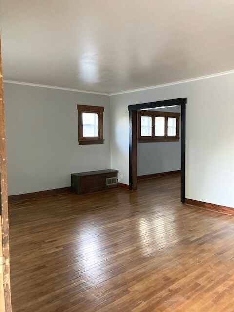 Living room opening into the dining room. - 1301 SW Clay St