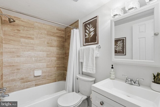 Building Photo - Welcome to this rarely available and beautifully updated ground-level condo offering the perfect ...