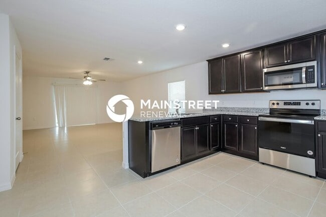 Building Photo - 4 Bedroom Pet-Friendly Home in Mascotte, FL with Main Street Renewal