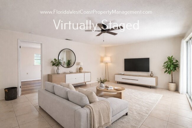 Building Photo - SPACIOUS SARASOTA HOME WITH LARGE FENCED YARD! MOVE IN READY! ALL TILE/ NEW LVP!