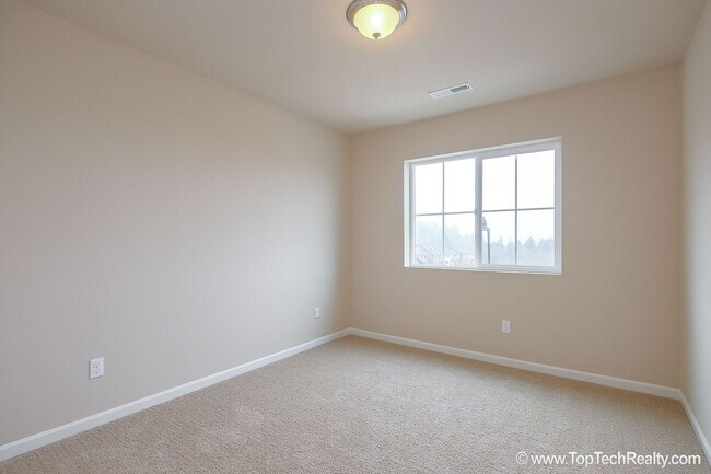 Building Photo - Spacious 4-Bedroom + Office Home in Abbey Creek – Modern Finishes, EV Charger & Low-Maintenance B...