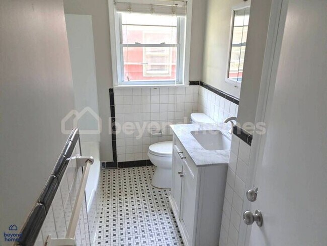 Building Photo - Updated Bungalow with Massive Deck and Fully Fenced Yard!