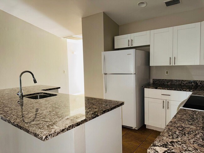 Building Photo - Experience this Cape Coral 3 bedroom 2 bath corner duplex with 1 car garage and screened in lanai.