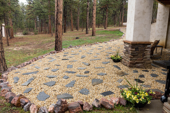 Gravel path and patio outside apartment door - 4125 Walker Rd