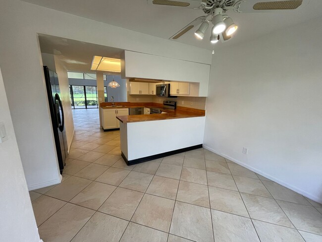 Building Photo - ANNUAL RENTAL - 2 + DEN / 2 BATH VILLA AT ...