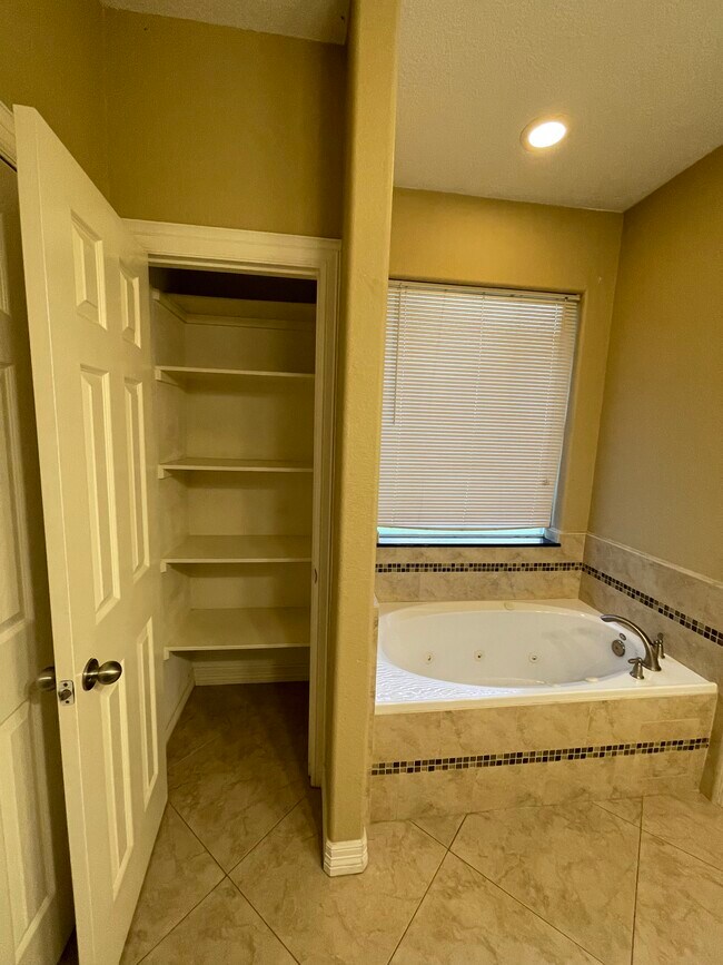 Linen closet in master bathroom - 600 River Bend Dr