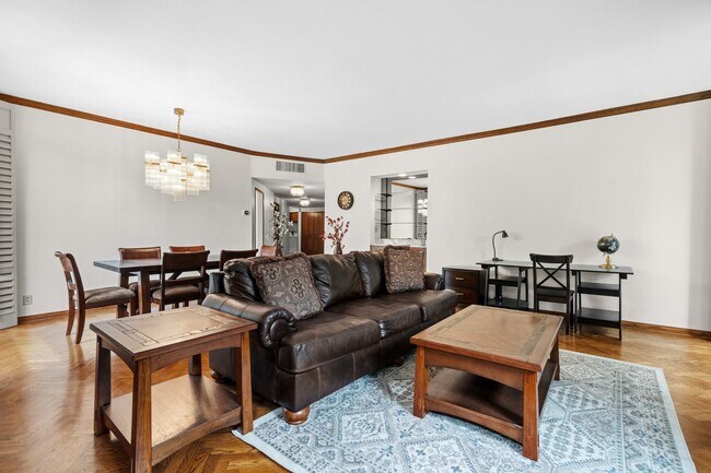 Building Photo - Elegant Corner Condo with Spacious Interiors