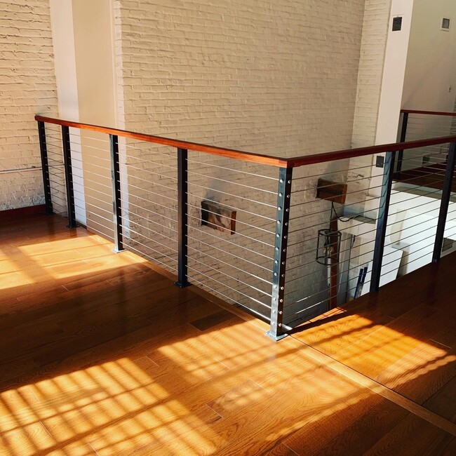 New railings throughout second story - 111 Church St