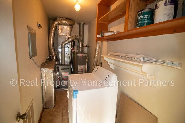 Building Photo - 2-Bed, 1-Bath Upper Unit with Garage & Porch – Steps from Paul Henry Trail