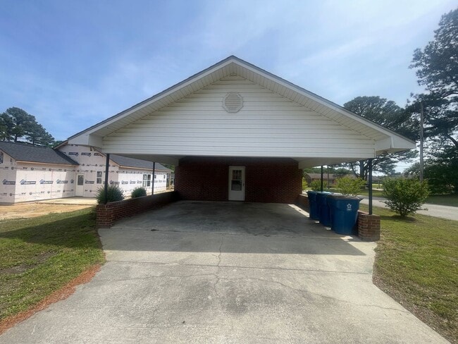 Building Photo - Brick Ranch- Dunn- 4 bedroom 2.5 bath- 2 car carport- Corner Lot