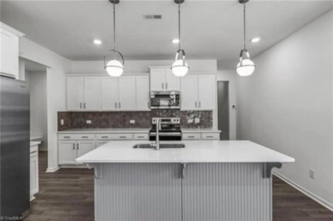 Building Photo - Spacious 3-Bedroom Townhome with Private Patio, Central HVAC & In-Unit Laundry Hookups
