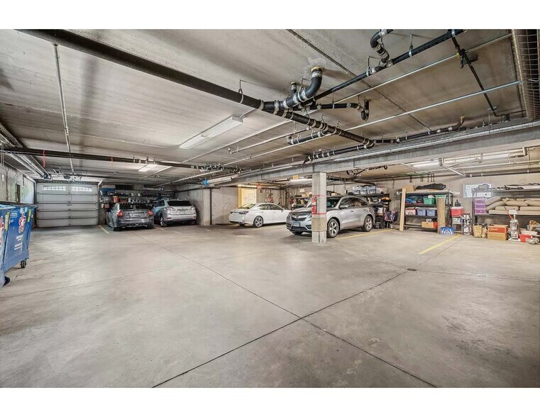 View of parking garage. One stall included with unit. Building garbage and recycling here - 3125 Inglewood Ave S