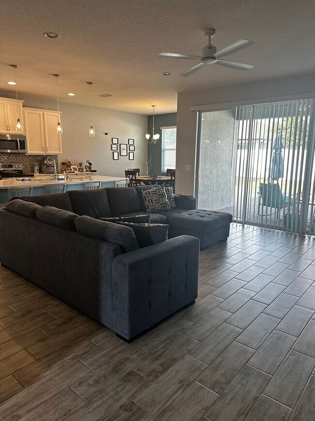 Building Photo - Welcome to this inviting 3/2 single family home located in Compass Landing