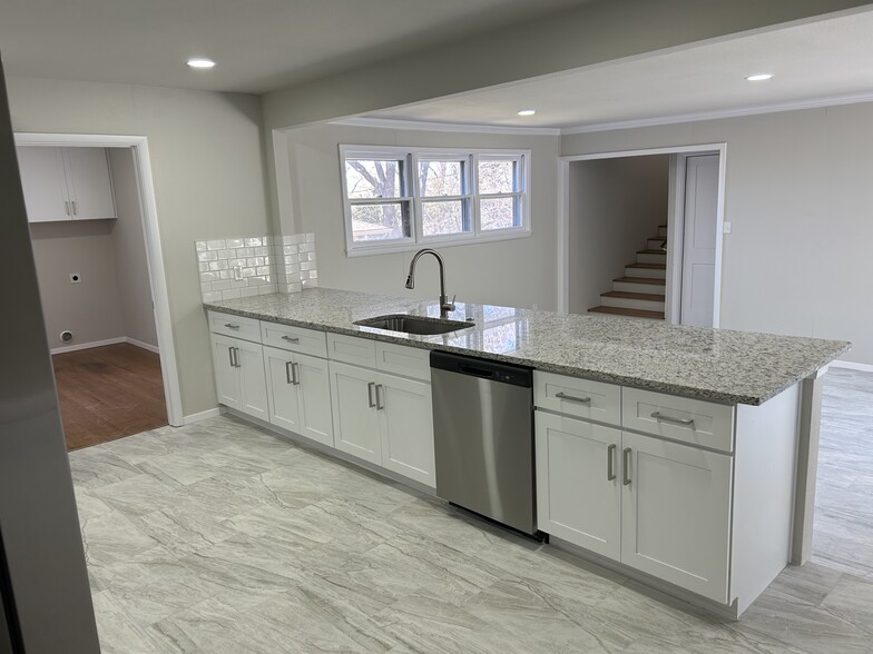 Kitchen with view into Laundry and across Dining Room to Stairs to new Master - 3404 Martin Lydon Ave