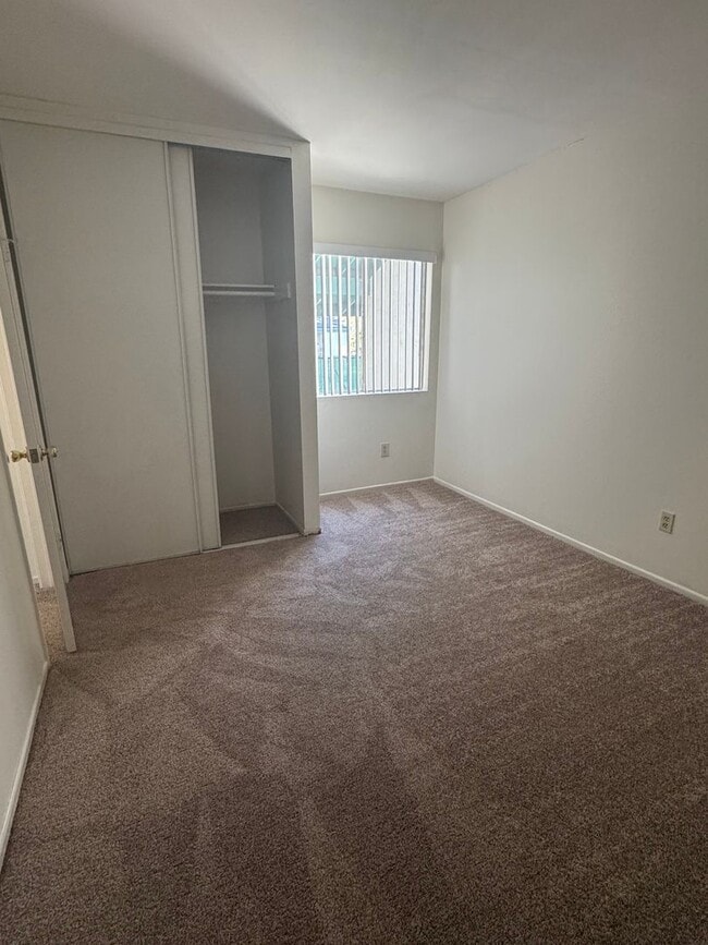Building Photo - Upstairs two-bedroom 1/12 bath condo avail...