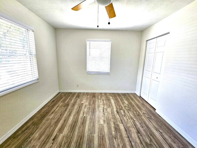 Building Photo - fully renovated 2-bedroom, 1-bathroom home with bonus guest room or office and oversized fenced yard