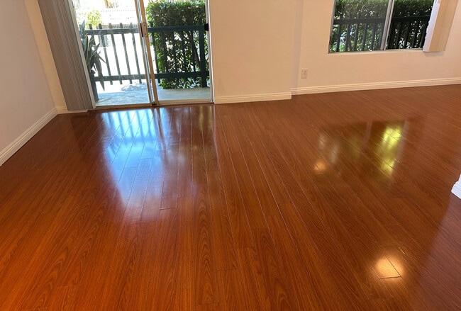 01 - Living Room + Private Patio - 1831 Barry Ave