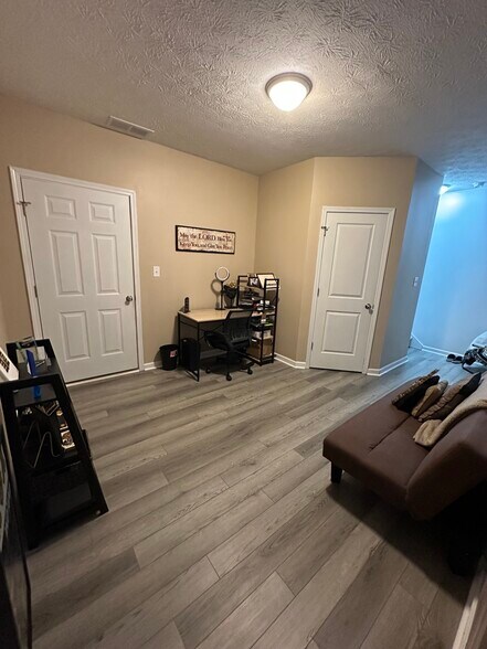 New grey plank flooring was recently installed - 2554 S Flat Rock Rd