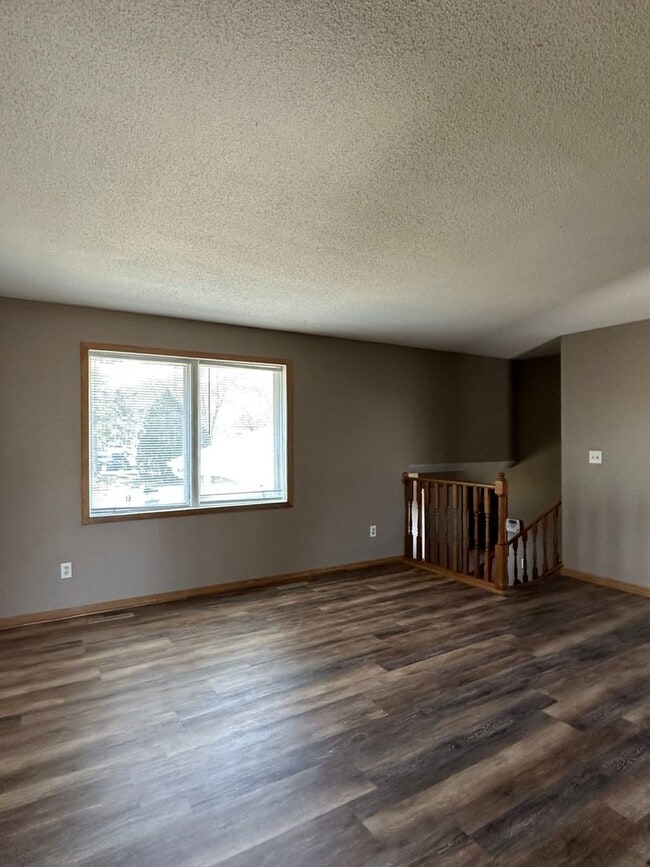 Building Photo - NE House for Rent 4 bedroom 2 full bathroom fenced in yard 2 Car attached garage.