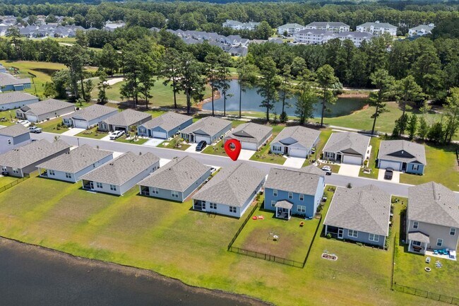 Building Photo - Modern 4BR Home with Screened Porch & Pond Views | Sun Colony, Longs SC