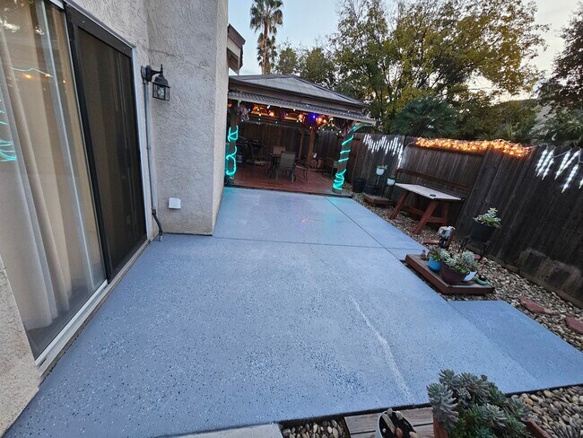 Outdoor Patio with brand new floor, beautiful pots of plants & garden host - 9316 Caulfield Dr