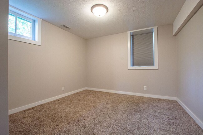 Building Photo - Adorable Brick 4 Bedroom Ranch with Finish...