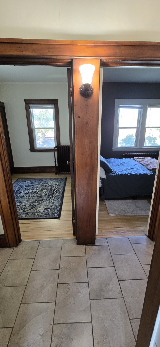 View from bathroom doorway looking through the hall, into bedrooms #2 and #1. - 533 Smith Ave S