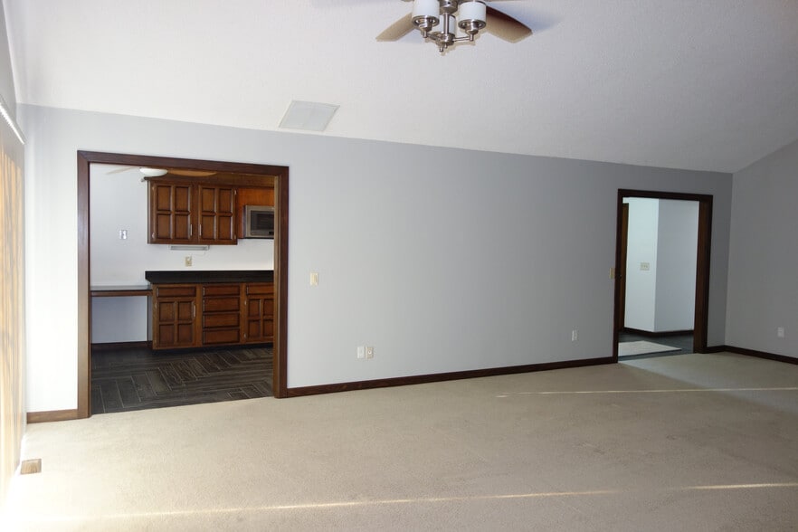 Living room view with kitchen entry on left and main unit entry on right - 3324 E 73rd St