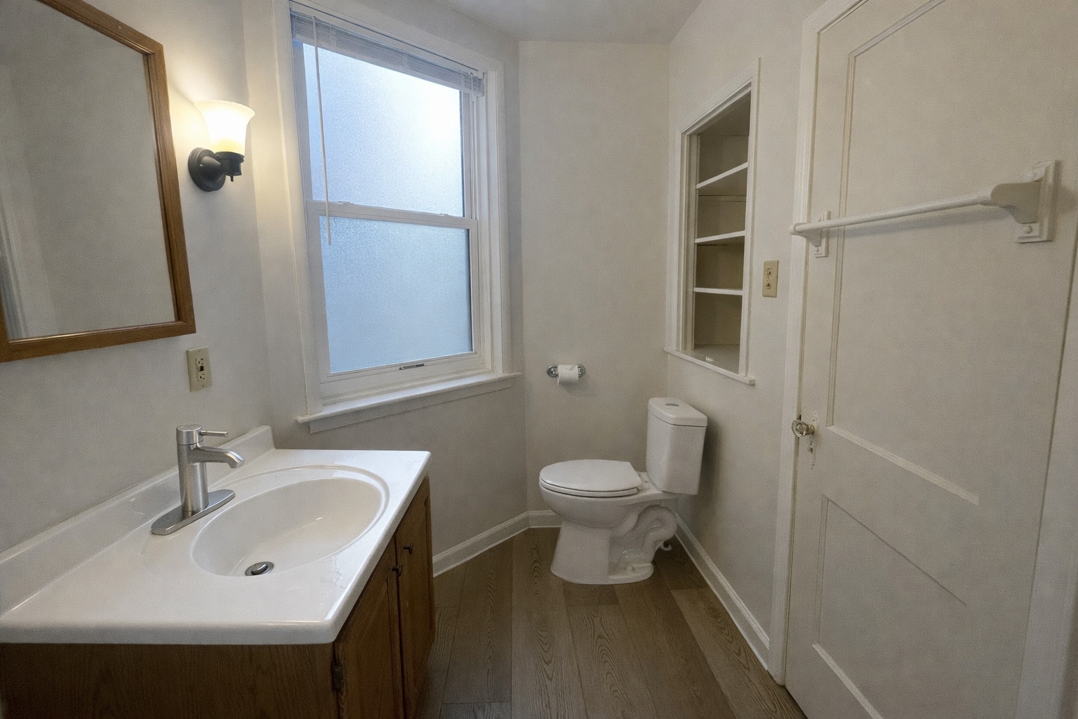 Bathroom with full size shower/bath and ample storage. - 513 1/2 W James St