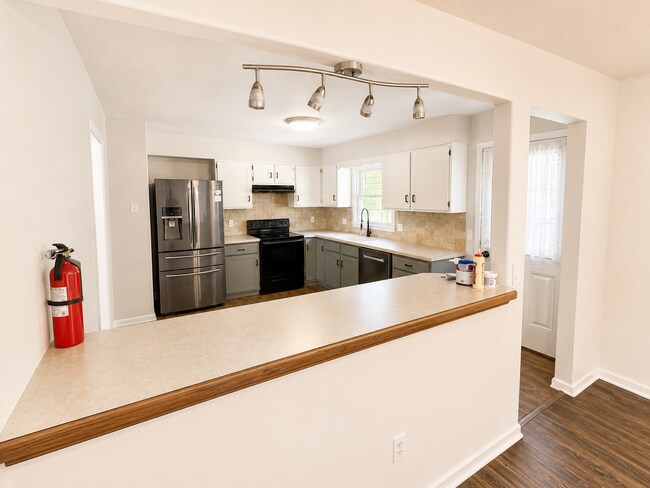 Building Photo - Spacious West Manhattan Home with Modern Updates, Oversized Garage & Prime Location