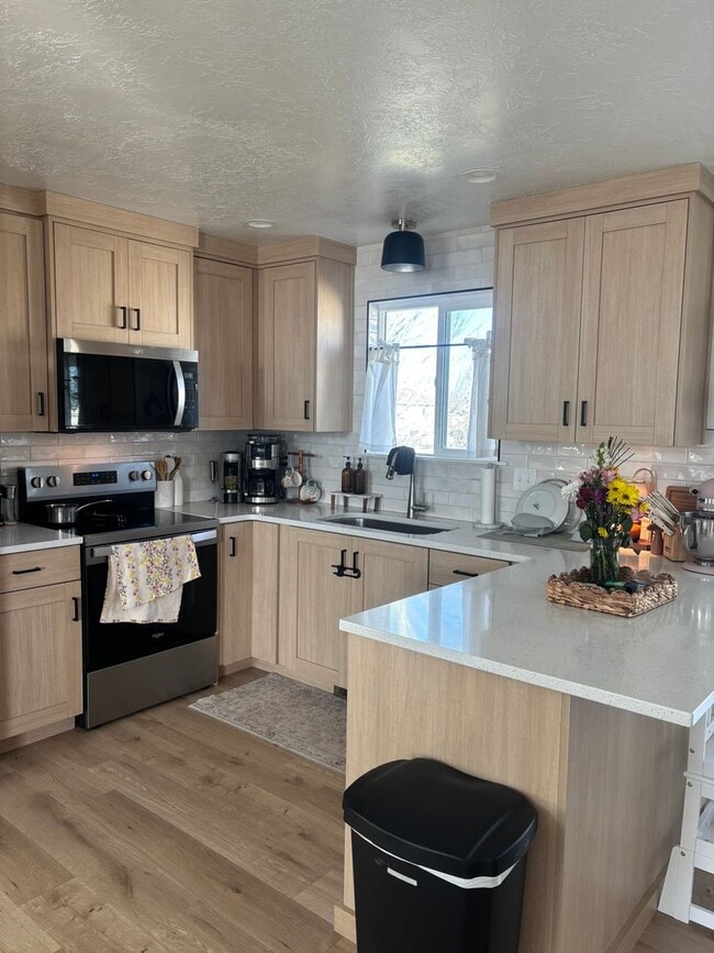 Building Photo - Beautiful remodeled home with fenced backyard and 2 car garage