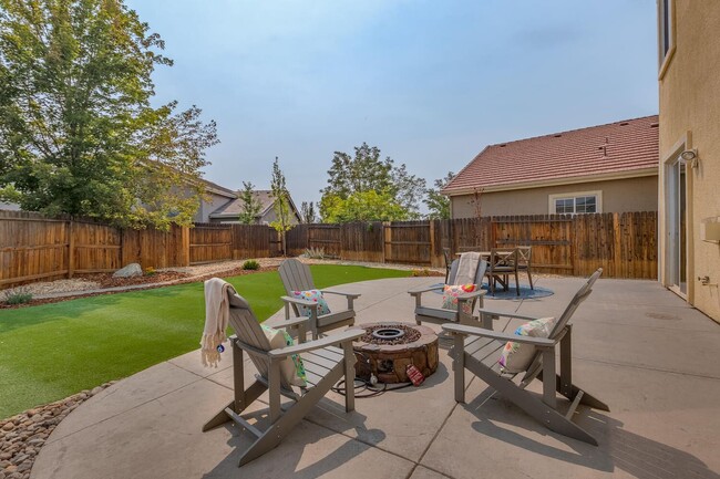 Gather around the gas fire pit and enjoy the newly landscaped backyard - 1698 Gemtown Dr