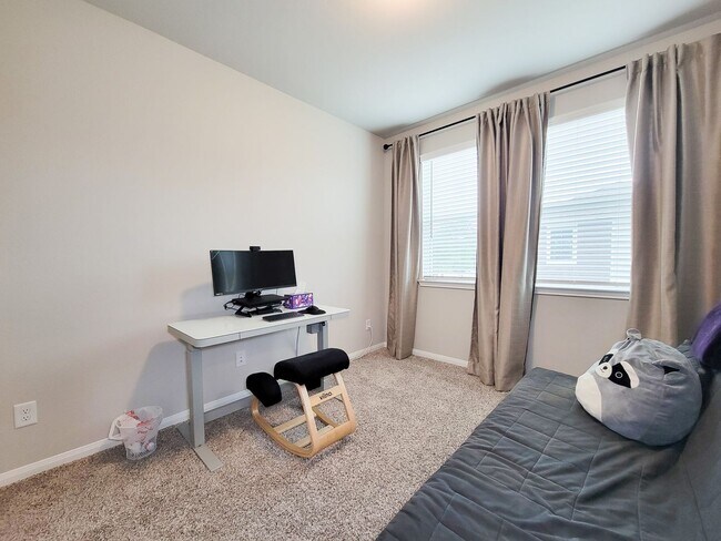 Building Photo - A true gem on a quiet corner lot, this spacious and sun-filled home is tucked away from street no...