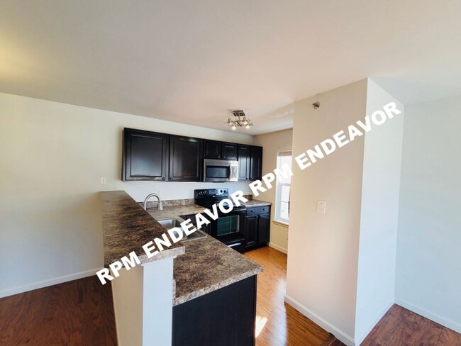 Building Photo - "Spacious 2-Bed, 2-Bath with Private Deck ...