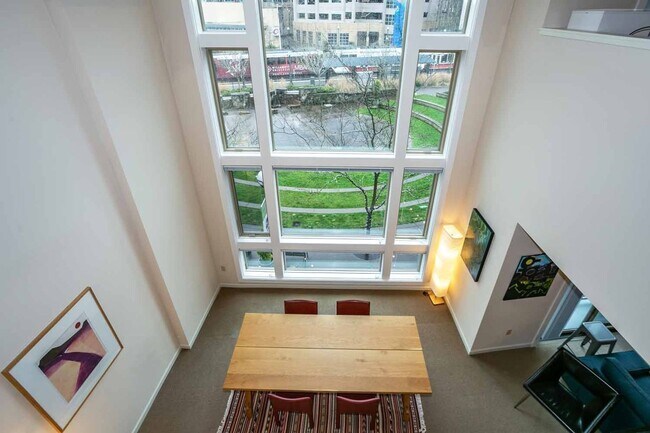 Building Photo - Gorgeous loft-style 2 floor condo with secured parking, A/C and rent includes most utilities!