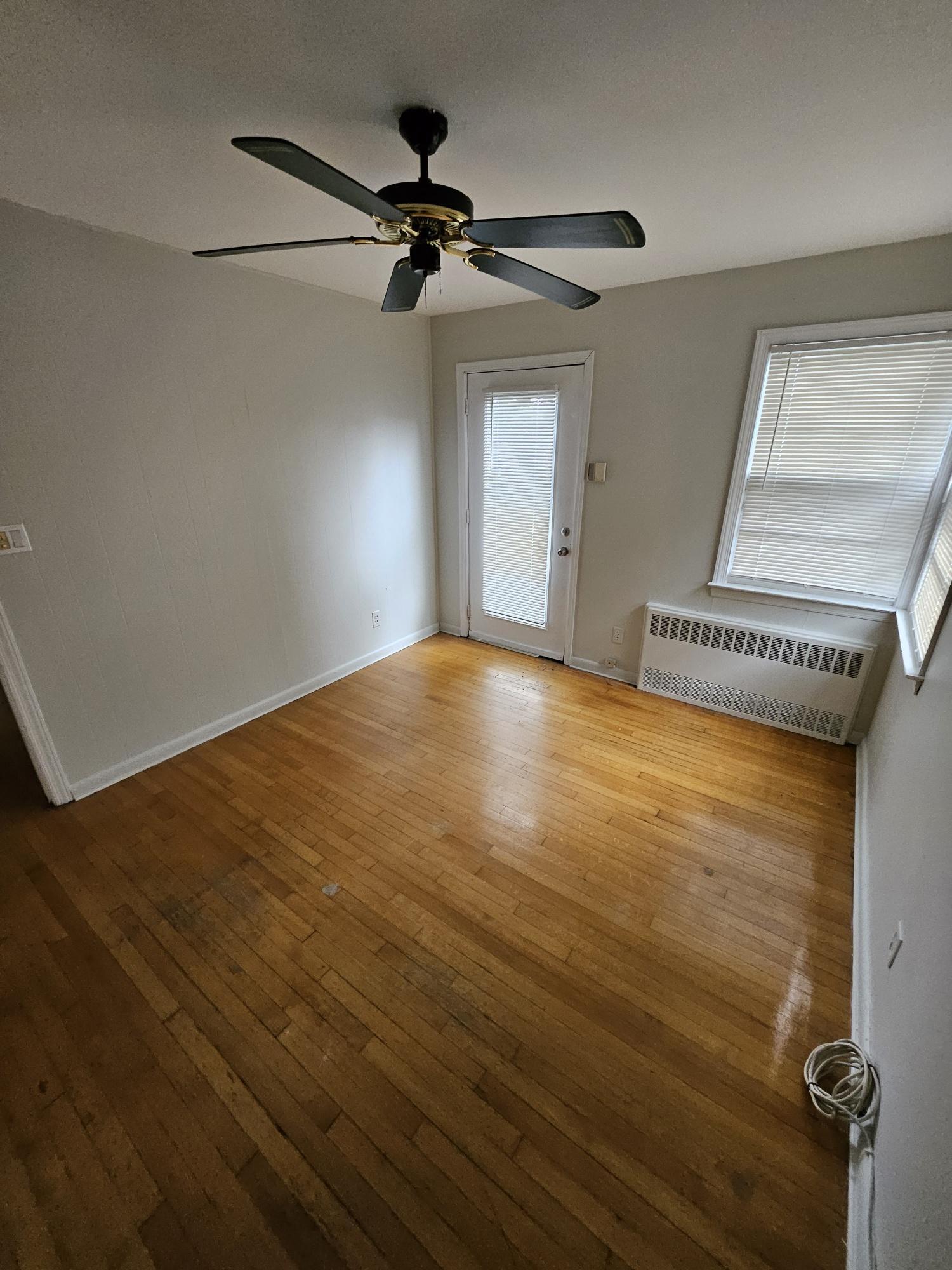 Bedroom 2 with separate entrance off deck to yard - 128 E Maple St
