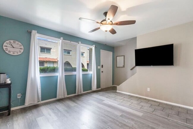 Building Photo - Discover this charming two-story townhome