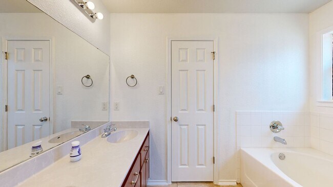 Building Photo - Completely repainted 4 bedroom ALL TILE ho...