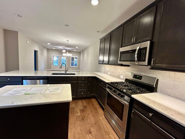 Building Photo - Spacious 3 bed, 3 bath home in Groves Park Commons featuring a modern kitchen, 2-car garage, and ...