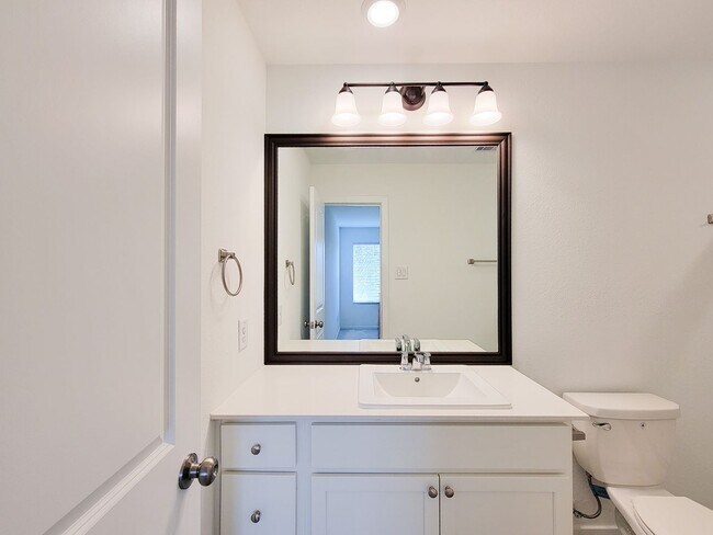 Building Photo - This single-level home showcases a spacious open floorplan shared between the kitchen, dining are...