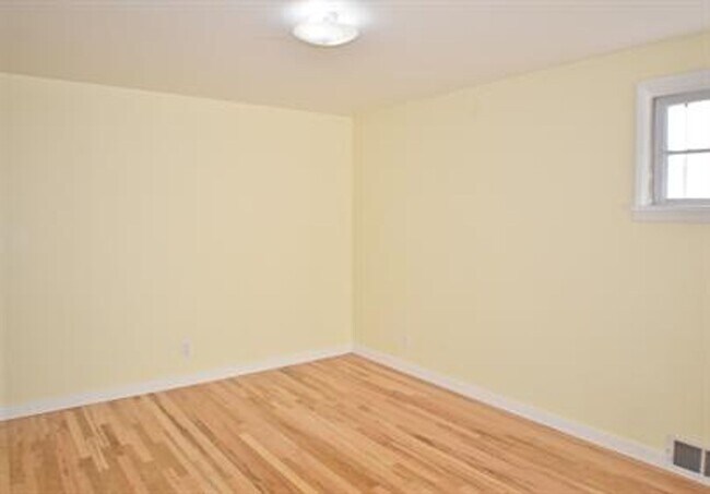 Building Photo - Updated house with original hardwoods and 2-car garage!