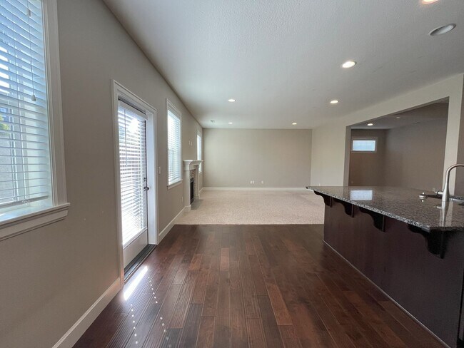 Building Photo - Spacious 4-Bedroom + Bonus Room with Modern Kitchen, Solar Panels & Private Fenced Backyard!