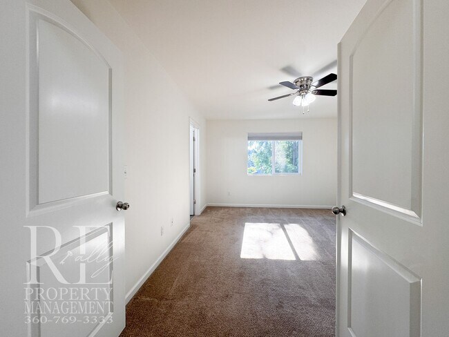 Building Photo - Spacious 3-Story Home with Flexible Living Space, Heat Pump & Private Deck Retreat