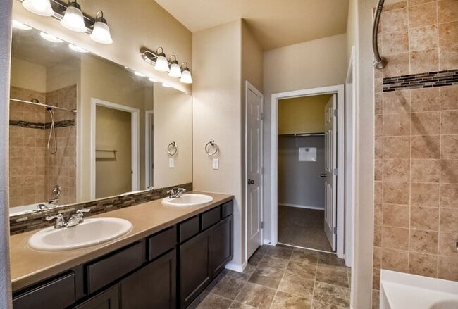 Building Photo - Immaculate 3-Bedroom Townhome with Stainless Steel Appliances and Attached Garage Near Peterson SFB