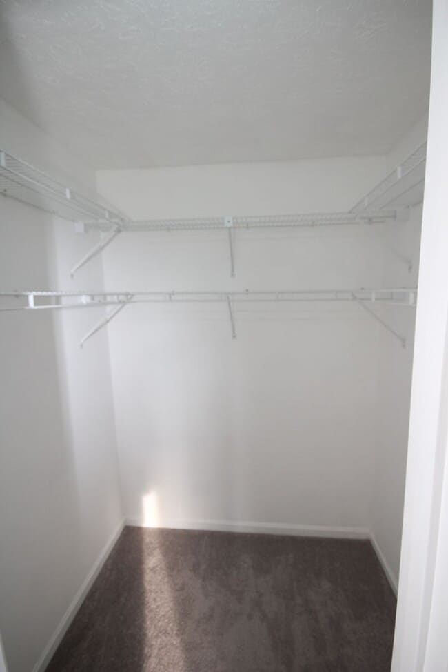 Building Photo - *Coming Soon*  Upgraded End Unit Townhome ...