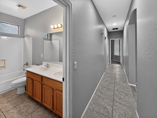 Building Photo - Single-level 4 bed, 2 bath home with tandem 3-car garage and RV gate.