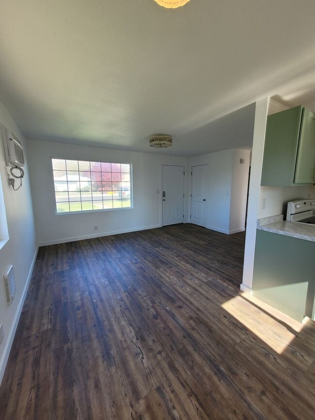 Building Photo - Free May rent with 1 Year Lease - Fully Remodeled with Garage & Yard Care Included