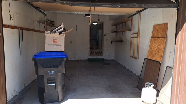 Attached garage with door to kitchen - 5341 SW 15th Ct